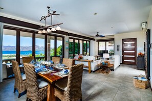 Dining area with floor to ceiling accordion windows.