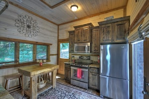 Full kitchen with butcher table.