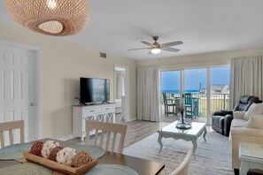 living room and dining room with beach views