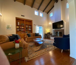 Large, comfortable living room with vaulted ceilings.