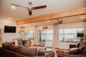 It’s hard to tell where the living room ends and the view begins— lakefront relaxation at its finest.