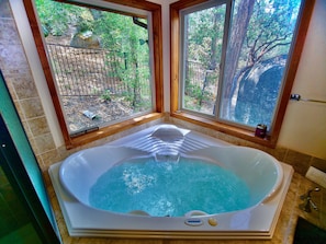 Primary bedroom features a private jetted tub!