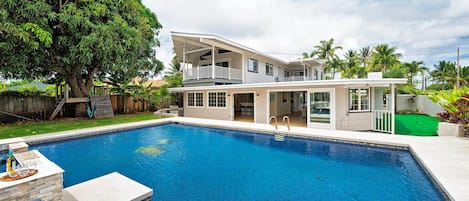 Lush backyard with large pool deck and pool give you all the feels of having your own private mini hotel!  (Note: Upper pool area is apart of the pool and NOT a spa)