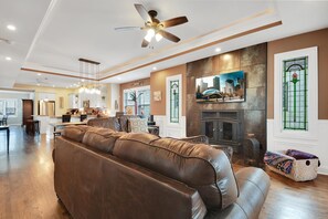  Large open living area with a wood-burning fireplace