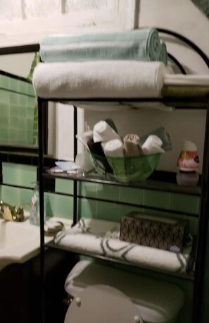 Bathroom with extra towels,wash cloths, shampoo conditioner soap toiletpaper etc