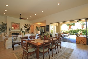 Kitchen and Dinning room with sliding glass door open to enjoy the pool/spa.