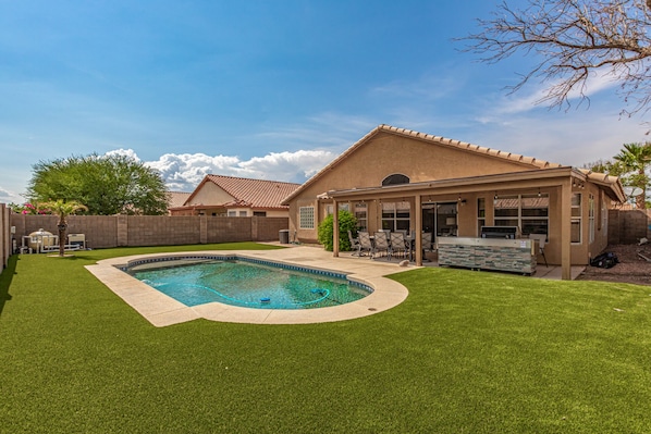Large private back yard and sparkling heated pool