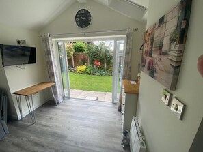 Double patio doors with a view into the well kept gardens
