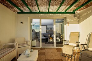 Apartment terrace, deck chair, coach, entrance