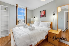 Bright, spacious bedroom 1 with comfortable double bed and amazing city view