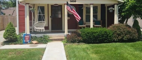 Large front porch with swings to enjoy the ambiance.