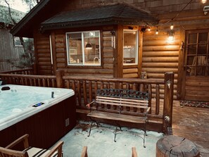 The hot tub is just out the front door and in a large seating area with grill