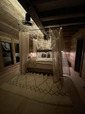 Romantic master bedroom is a honeymooners dream!