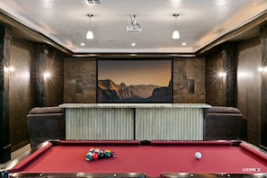 Theather room with lots of comfy seating