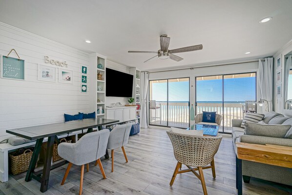 Beachfront location! Living room with the beach views. Faces sunset! 