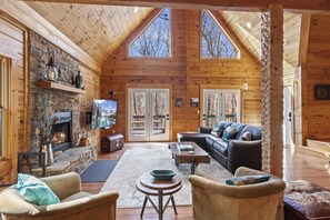 Great Room with Leather Furniture, Vaulted Ceilings, and Wood Floors