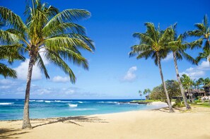 Beautiful Poipu Beach with clear, blue water.