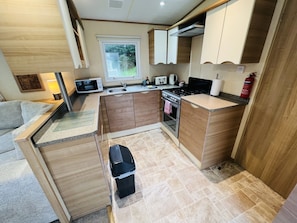 The modern kitchen in our dog friendly caravan, Shanklin, Isle of Wight. 