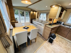 The open-plan living space in our 2-bedroom caravan, Shanklin, Isle of Wight 