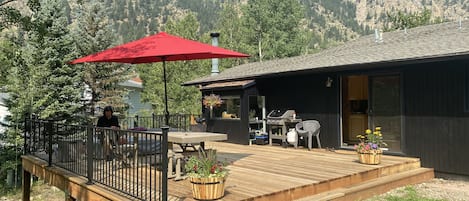 Large deck off yard. View of mountains in every direction