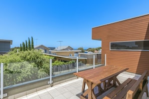 Outdoor balcony with ocean glimpses