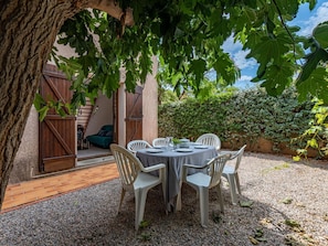 Furniture, Plant, Table, Shade, Window, Building, Chair, Outdoor Furniture, Wood, Outdoor Table