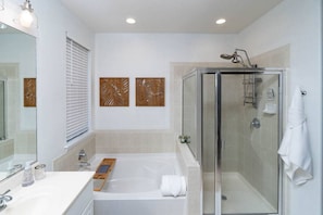 Primary bathroom includes separate walk-in shower and bathtub