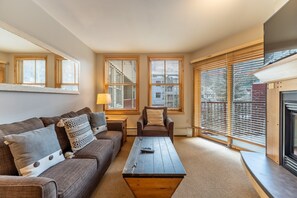 Living area offering a gas fireplace and cozy furnishings.