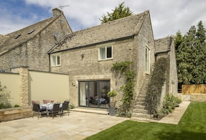 South facing rear walled garden with large terrace and garden furniture