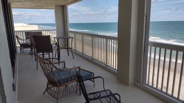 Large and wide corner balcony offers beautiful ocean views