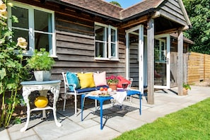 Daphne's Studio, near Dorchester: The colourful seating area for alfresco dining
