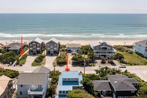 Home is steps away from beach access boardwalk (left arrow).