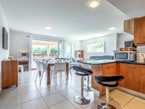 Property, Furniture, Table, Cabinetry, Countertop, Kitchen Appliance, Interior Design, Lighting, Kitchen, Wood