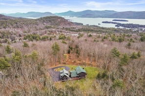 Aerial view of property and Lake George in distance.