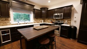 Kitchen with small wine fridge *no alcohol included* Visit the valley liquor store in the cabins by the Valley Market