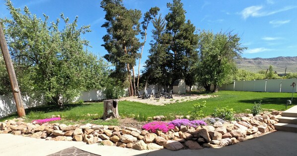 Back yard with Fire pit and lounge chairs