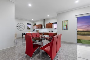 Open Plan Dining and Kitchen Areas with access to backyard