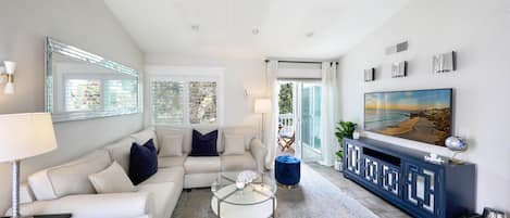 Coastal inspired living room with plenty of natural sunlight and ocean breezes