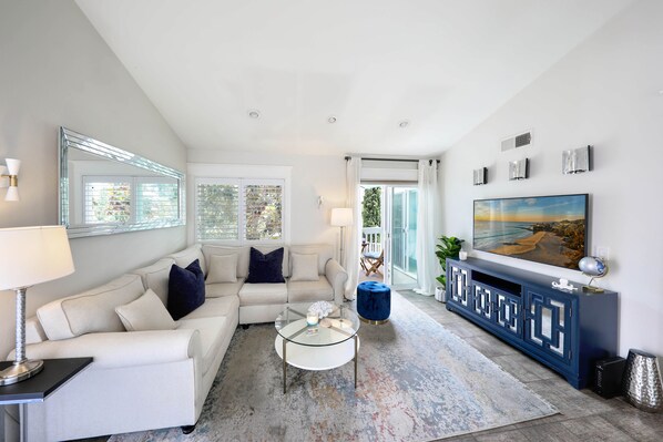 Coastal inspired living room with plenty of natural sunlight and ocean breezes