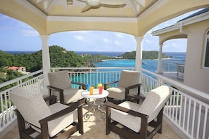 You enter Oleander on the upper level, where you are greeted by this covered deck and its gorgeous view