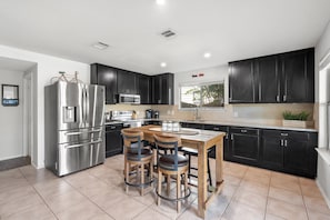 Spacious and updated kitchen with island and a lot of counter space.