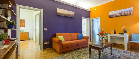 The large colourful living room is the heart of the house to relax over a drink.