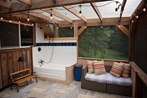 The porch of delight...with an outdoor shower and tub