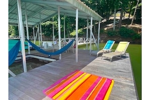 Spacious dock with room to spread out in the sun or under cover. Swim-up bench!