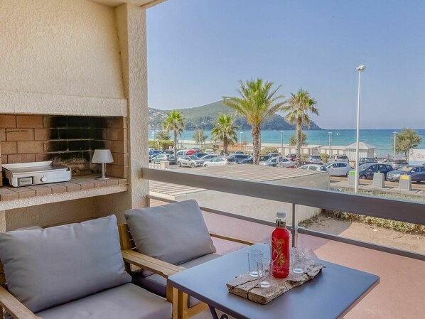 Furniture, Table, Sky, Water, Property, Azure, Building, Seaside Resort, Shade, Interior Design