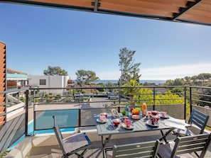 Sky, Furniture, Property, Table, Building, Chair, Shade, Interior Design, Outdoor Furniture, Window