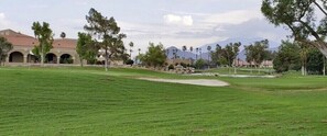 Your 18th green, mountain and clubhouse views await you