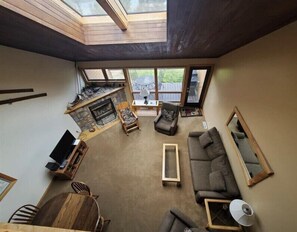 Living Room includes gas fireplace, cable tv, board games and sleeper sofa.