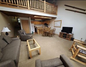 Living room and fully stocked kitchen