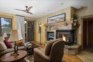 Cozy living room that leads to outdoor patio space.